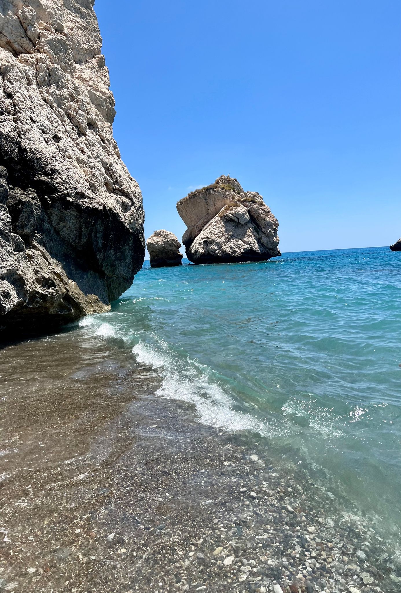 Beach with rocks and sun