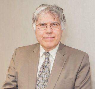 Headshot of John Evdokias